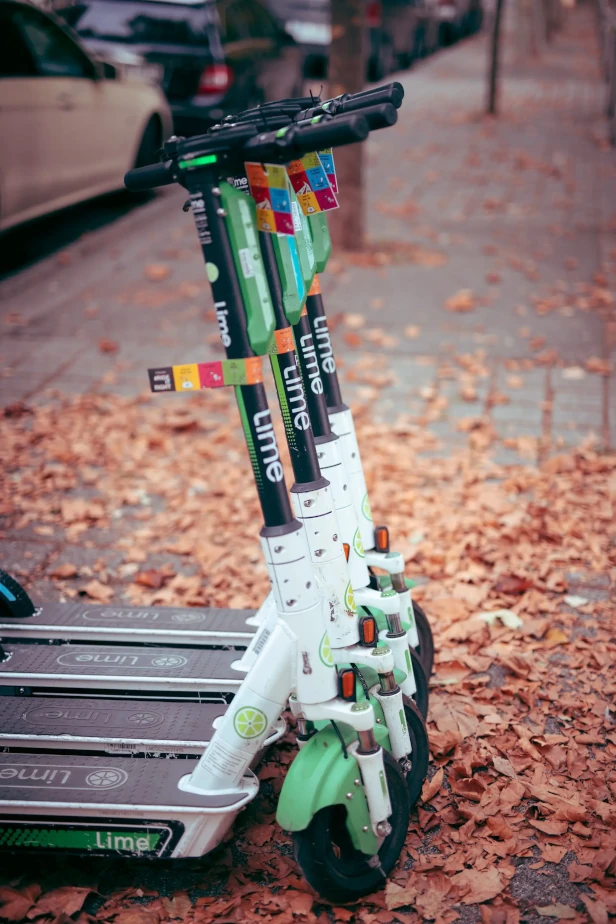4 Lime rideshare electric-scooters lined up